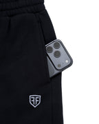 Anchor Midweight Jogger in Black, side phone pocket and embroidered shield