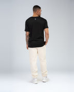 Anchor Midweight Jogger in Ecru, full-length back on model