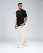 Anchor Midweight Jogger in Ecru, full-length front on model