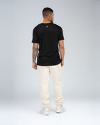 Apex Tech Tee in Black, full-length back on model