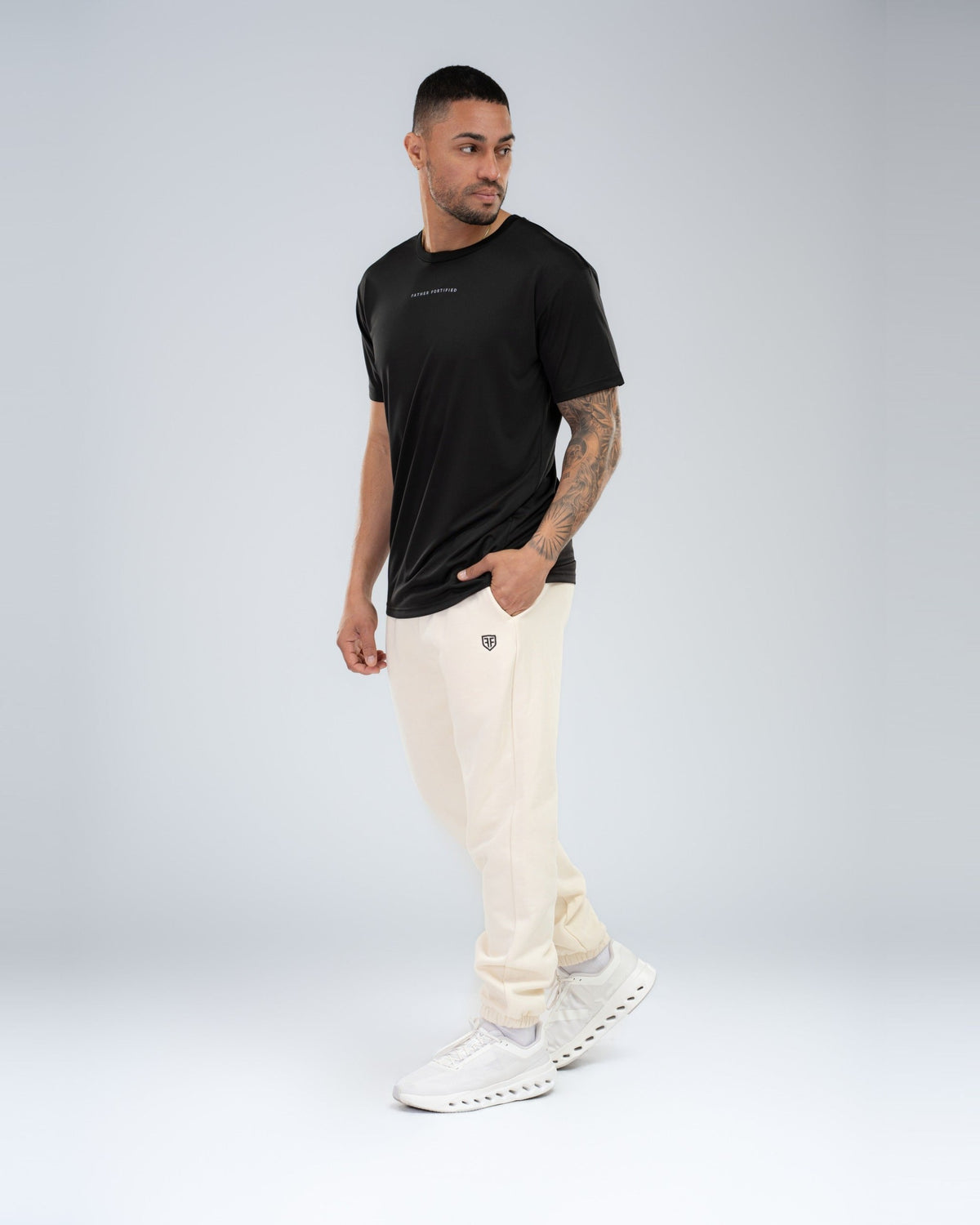 Apex Tech Tee in Black, full-length front on model