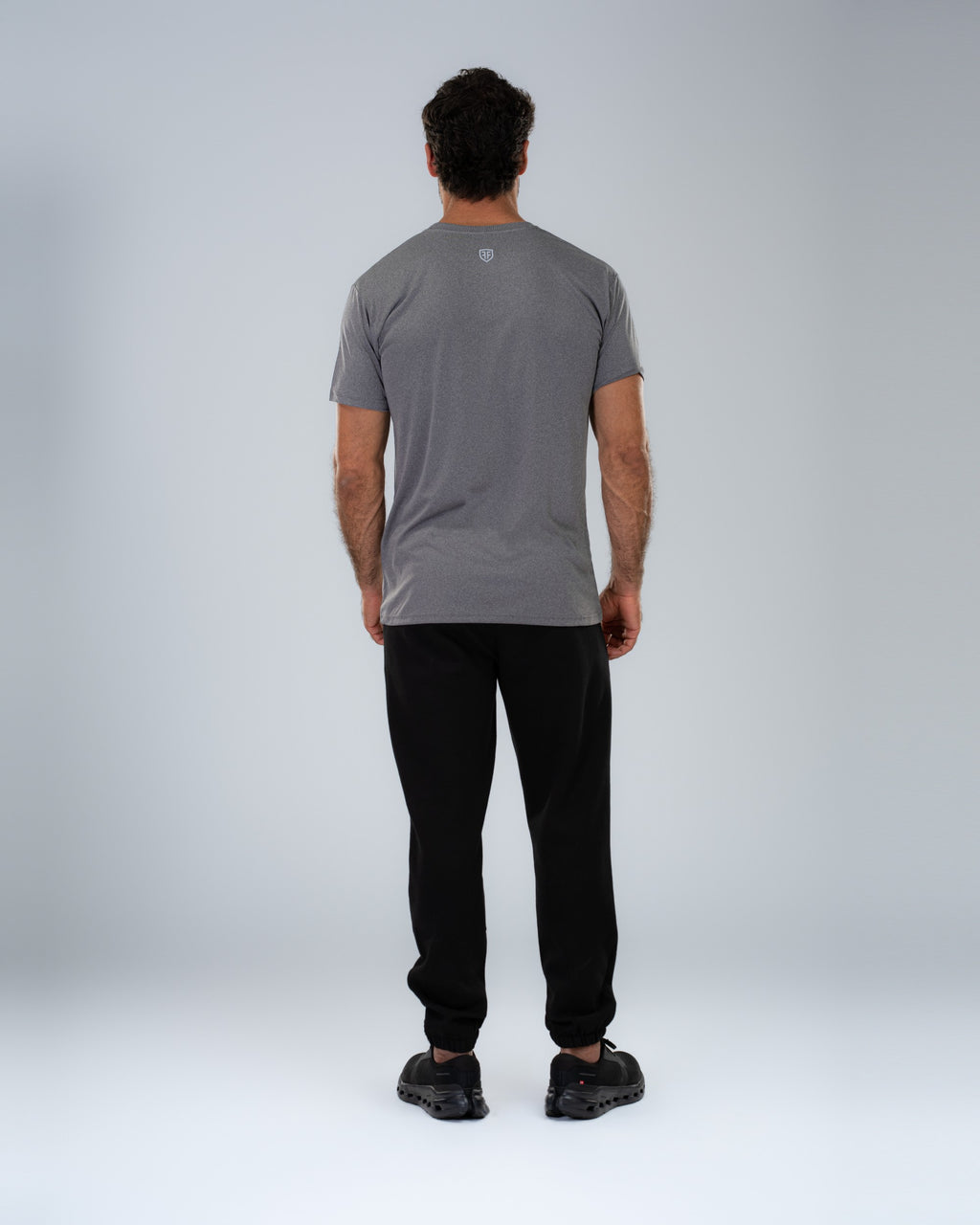 Apex Tech Tee in Graphite, full-length back on model