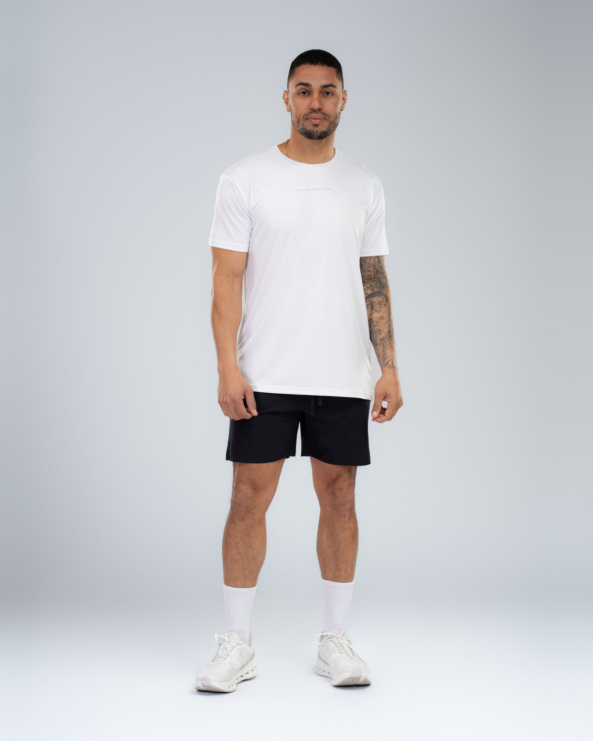 Apex Tech Tee in White, full-length front on model