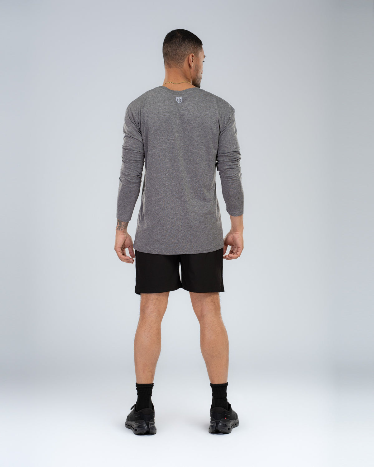 Core Short 6.5" in Black, full-length back on model