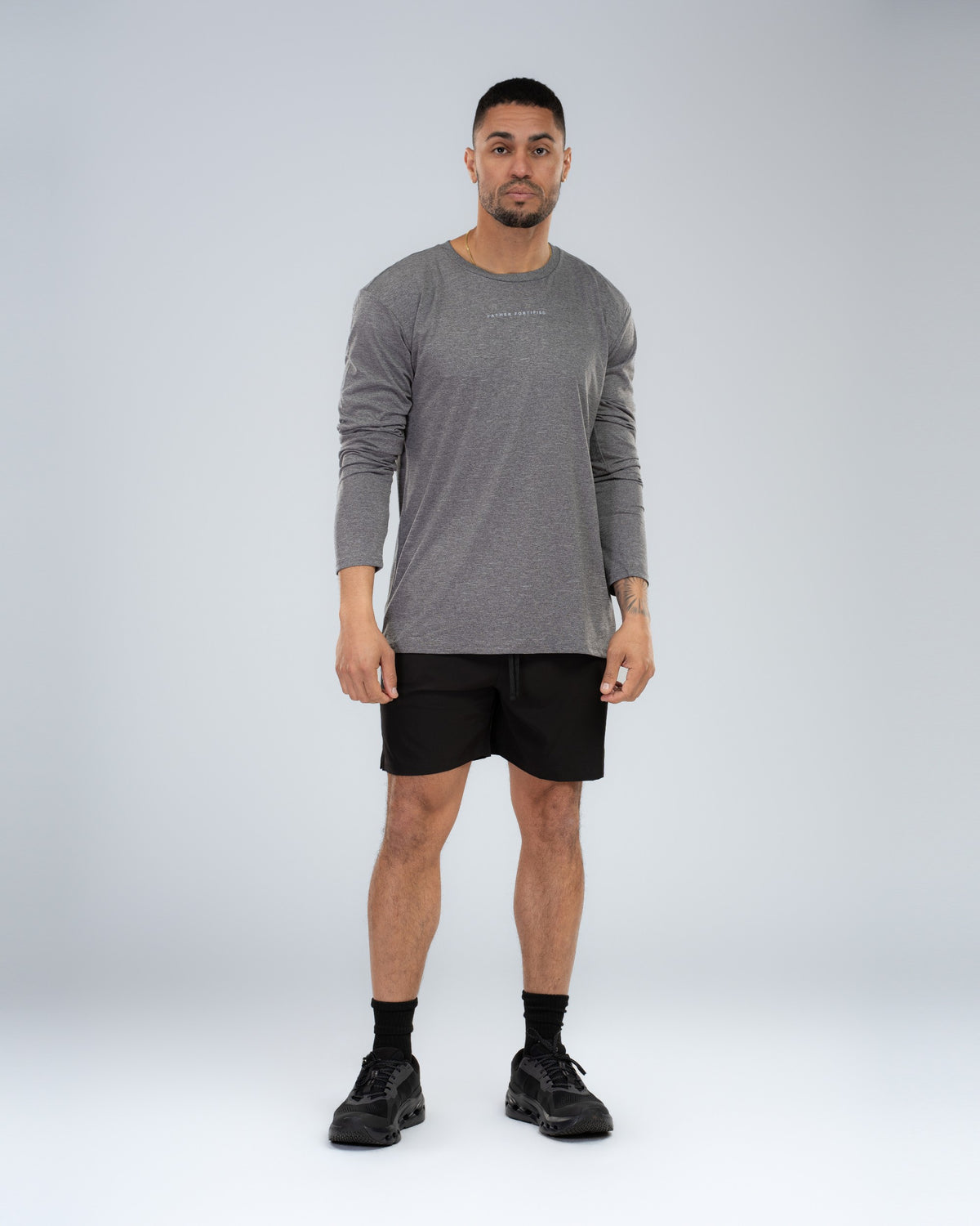 Core Short 6.5" in Black, full-length front on model