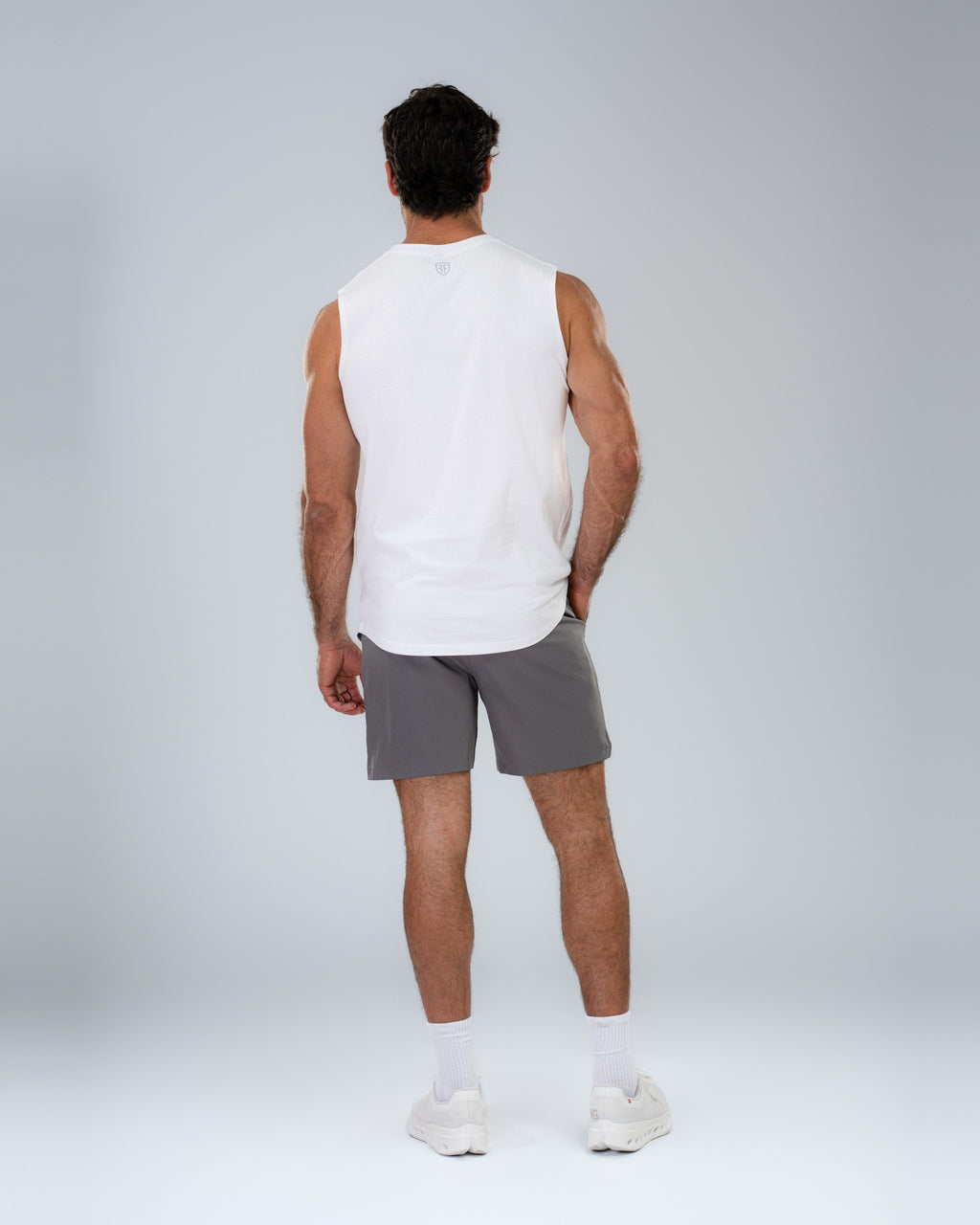 Core Short 6.5" in Stone, full-length back on model