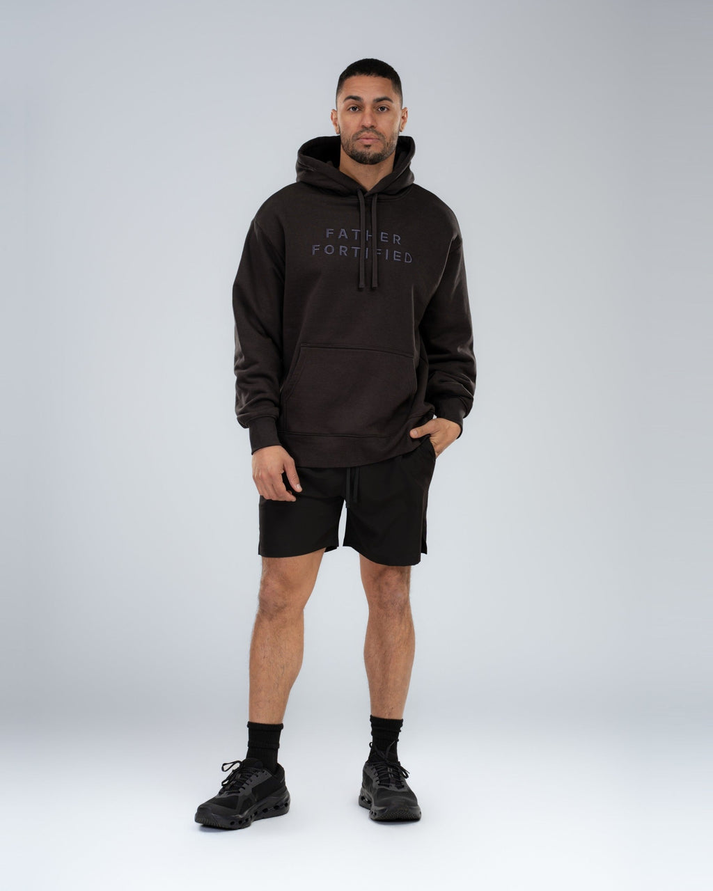 Mainstay Heavyweight Hoodie in Coal, full-length on model