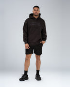 Mainstay Heavyweight Hoodie in Coal, full-length on model