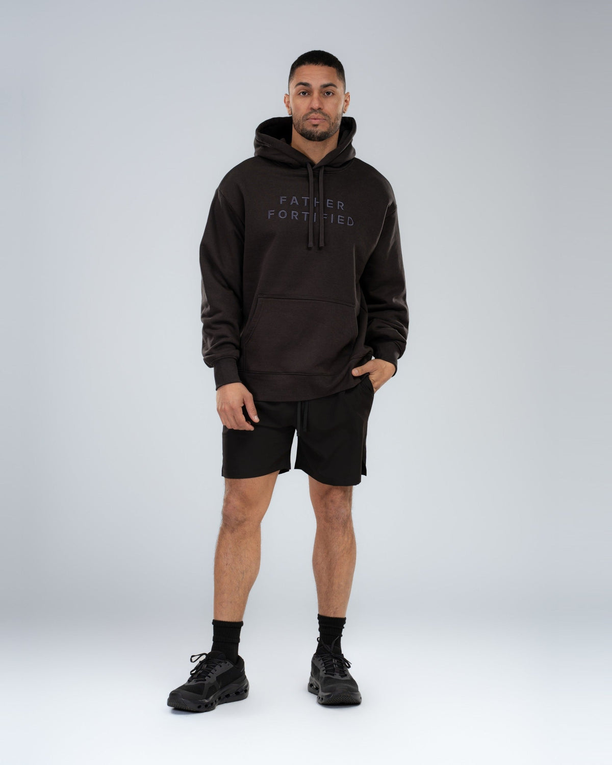 Mainstay Heavyweight Hoodie in Coal, full-length on model